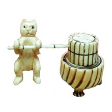 OX BONE CARVED CAT PUSH MILLSTONE
