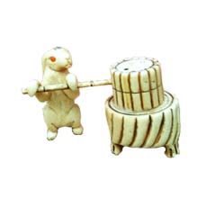 OX BONE CARVED RABBIT PUSH MILLSTONE