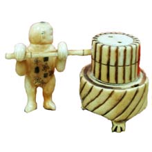 OX BONE CARVED KID PUSH MILLSTONE